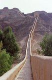 The Overhanging Great Wall (Xuanbi Changcheng) was built during the Ming Dynasty (1368 - 1644).<br/><br/>

Jiayuguan, the ‘First and Greatest Pass under Heaven’, was completed in 1372 on the orders of Zhu Yuanzhang, the first Ming Emperor (1368-98), to mark the end of the Ming Great Wall. It was also the very limits of Chinese civilisation, and the beginnings of the outer ‘barbarian’ lands.<br/><br/>

For centuries the fort was not just of strategic importance to Han Chinese, but of cultural significance as well. This was the last civilised place before the outer darkness, those proceeding beyond, whether disgraced officials or criminals, faced a life of exile among nomadic strangers.<br/><br/>

Jiayuguan or Jiayu Pass (literally "Excellent Valley Pass") is the first pass at the west end of the Great Wall of China, near the city of Jiayuguan in Gansu province.